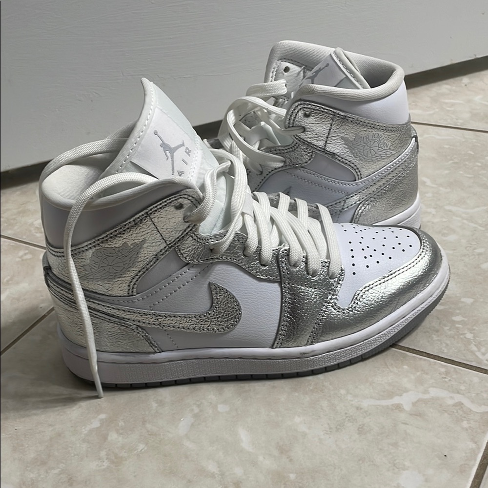 Nike Silver and White Sneakers with Classic Design